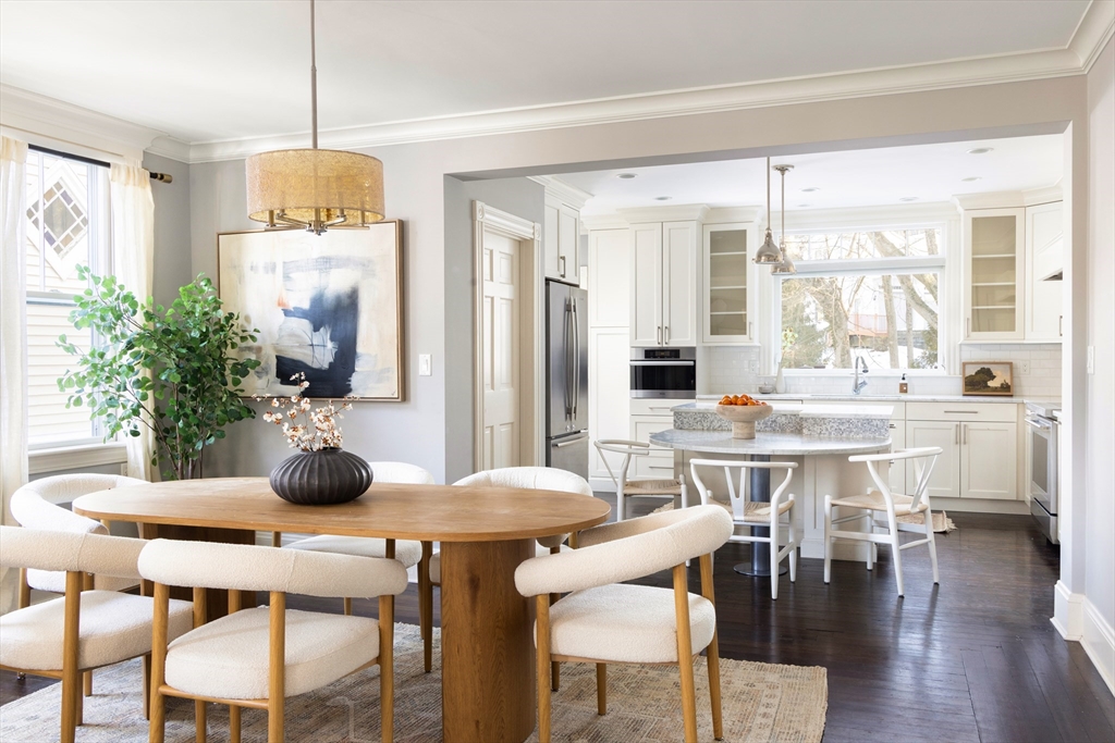 26 Knowles Street, Unit 26 Newton, MA 02459 - Photo 3 of 16 a very nice looking dining room with kitchen island granite countertop a table and a chairs