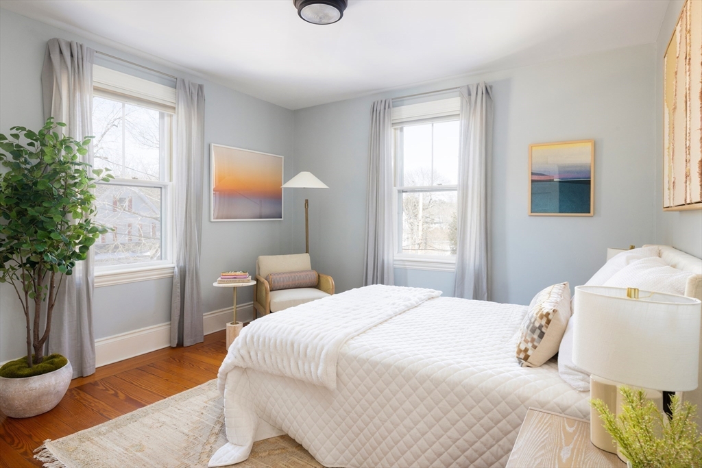 26 Knowles Street, Unit 26 Newton, MA 02459 - Photo 9 of 16 a bedroom with a bed and a potted plant