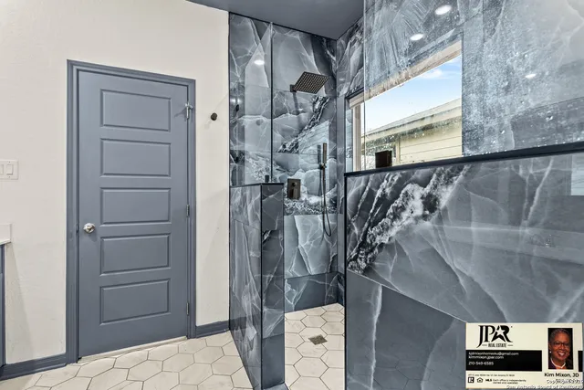 a spacious bathroom with a sink double vanity and shower