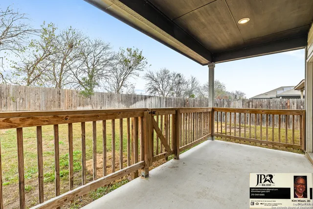 a view of a house with backyard porch and sitting area