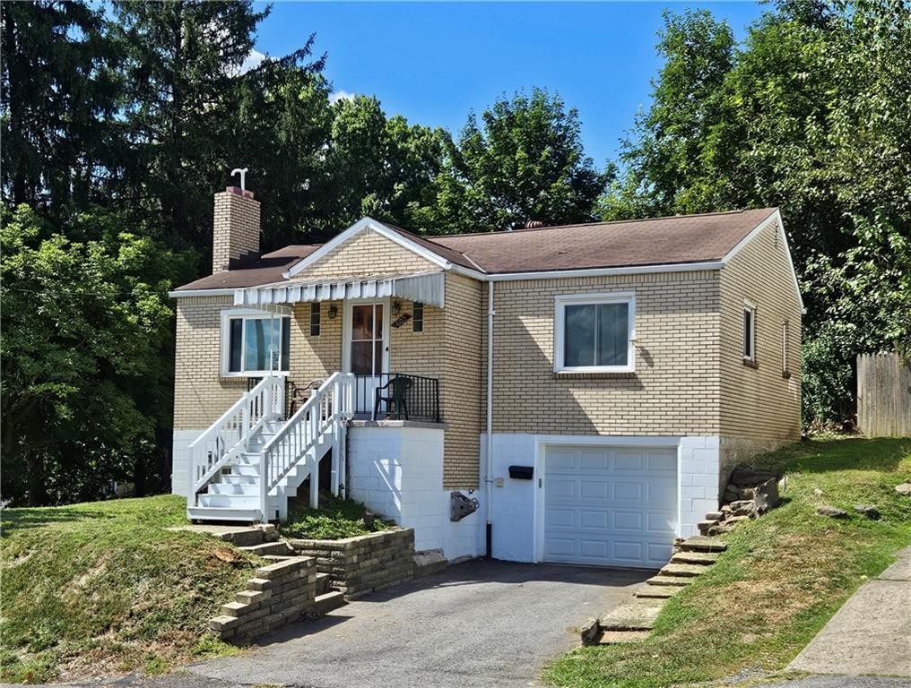 605 McCoy Road McKees Rocks, PA 15136 - Photo 1 of 39 a front view of a house with garden