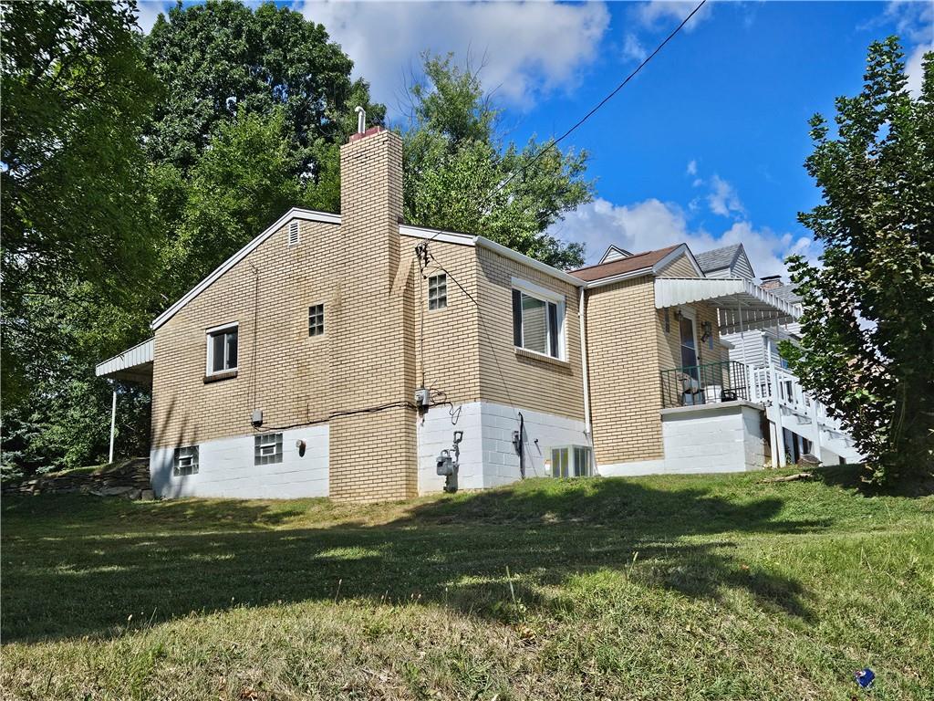 605 McCoy Road McKees Rocks, PA 15136 - Photo 20 of 39 a aerial view of a house with a yard