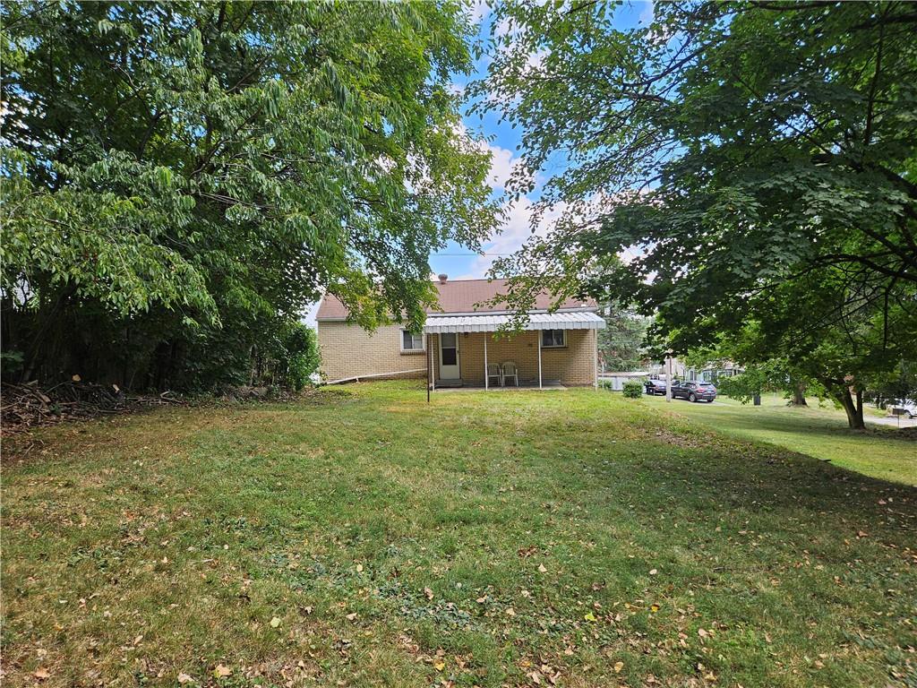 605 McCoy Road McKees Rocks, PA 15136 - Photo 22 of 39 a front view of a house with a garden
