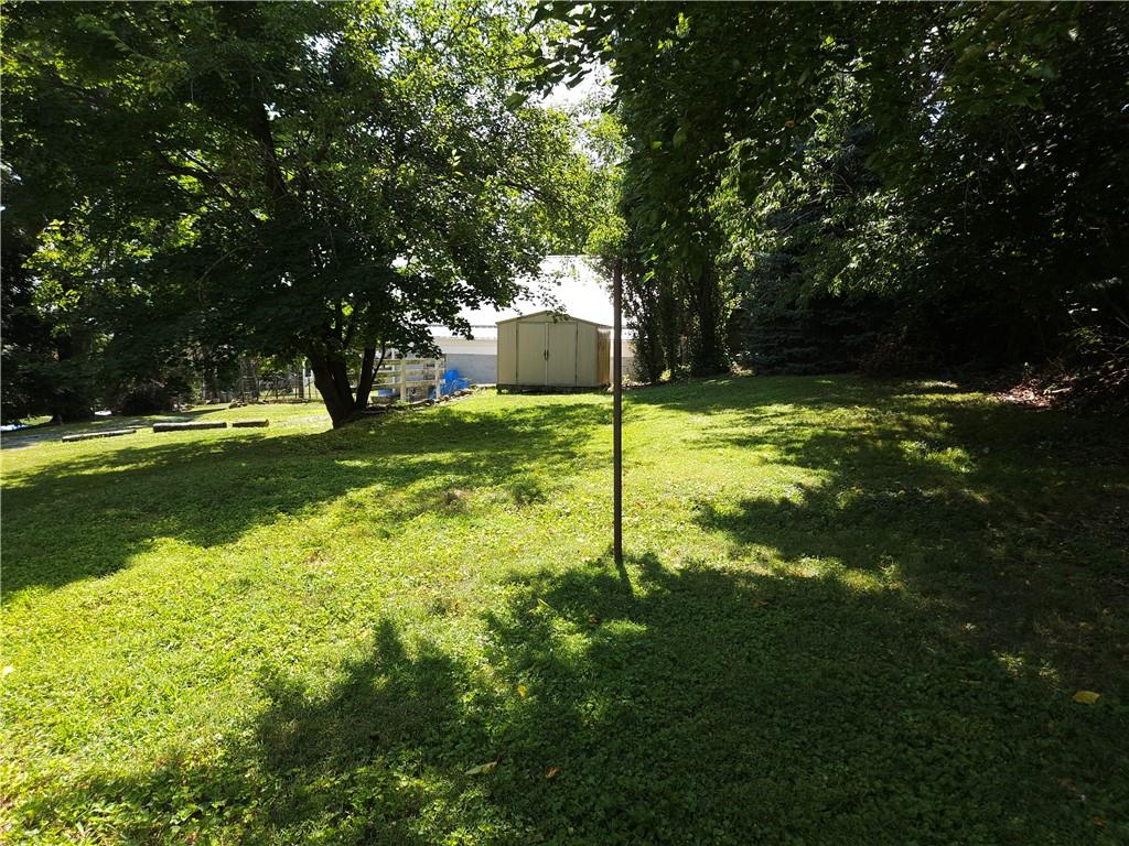 605 McCoy Road McKees Rocks, PA 15136 - Photo 24 of 39 a backyard of a house with swimming pool and green space