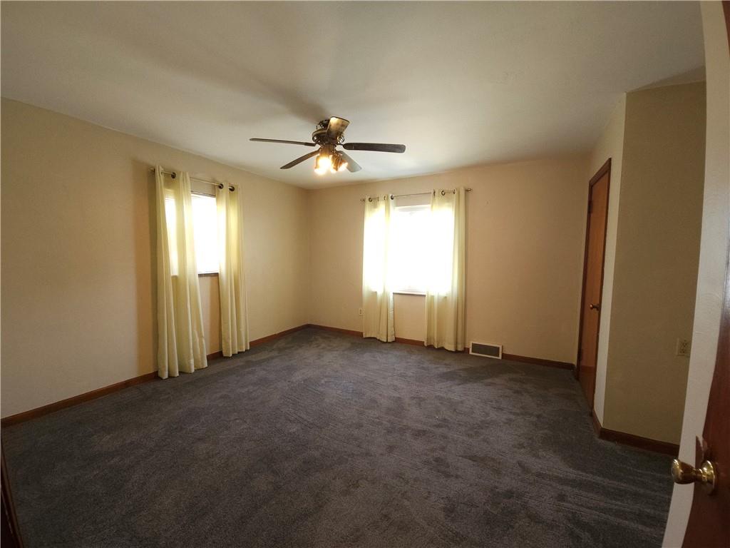 605 McCoy Road McKees Rocks, PA 15136 - Photo 26 of 39 an empty room with windows and fan