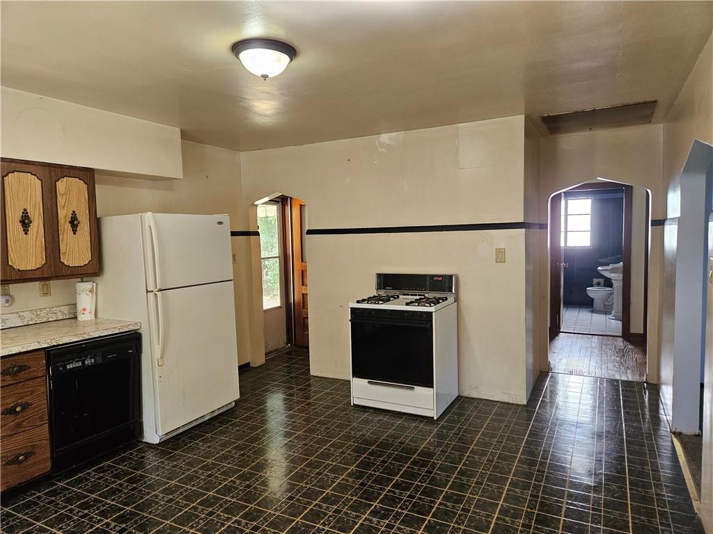 605 McCoy Road McKees Rocks, PA 15136 - Photo 32 of 39 a view of kitchen with stainless steel appliances granite countertop a refrigerator and a stove