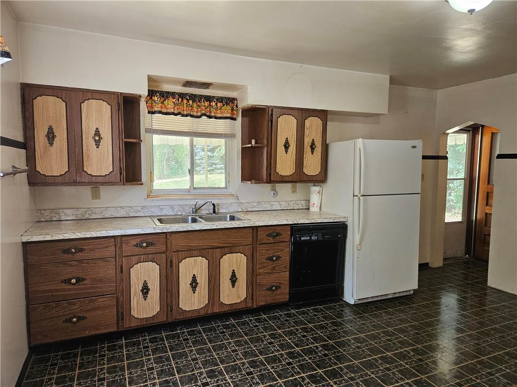 605 McCoy Road McKees Rocks, PA 15136 - Photo 33 of 39 a kitchen with a refrigerator and a sink