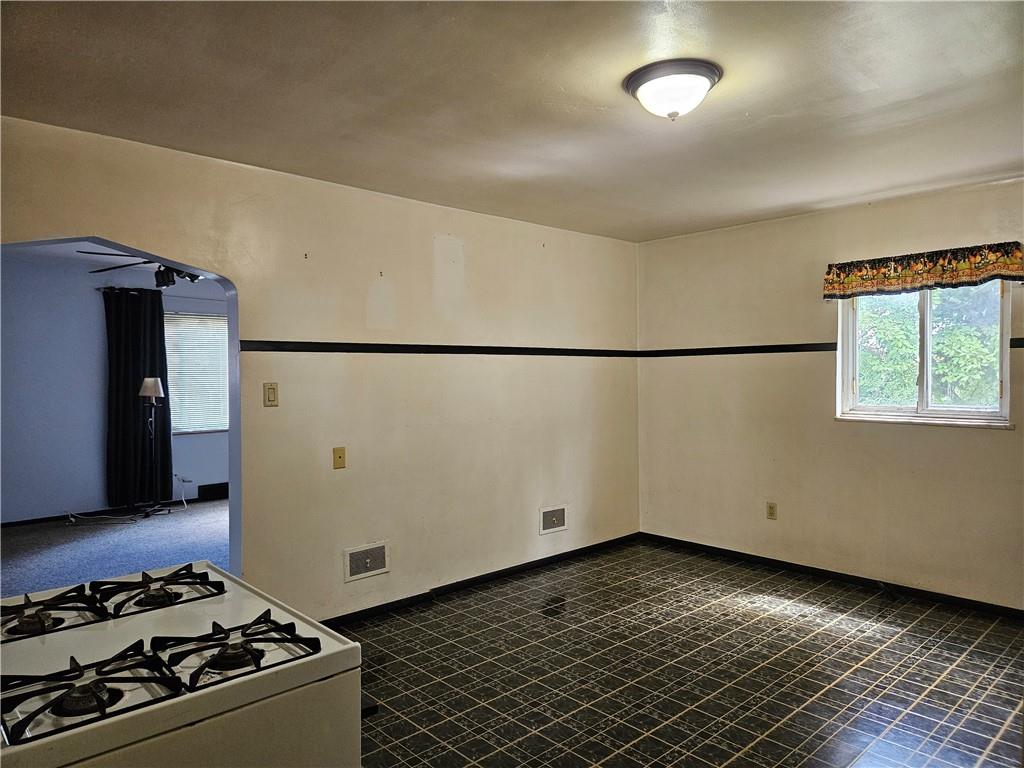 605 McCoy Road McKees Rocks, PA 15136 - Photo 34 of 39 a view of a refrigerator in kitchen and an empty room