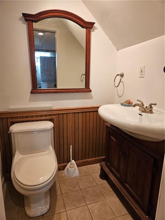 605 McCoy Road McKees Rocks, PA 15136 - Photo 6 of 39 a bathroom with a sink a toilet and mirror