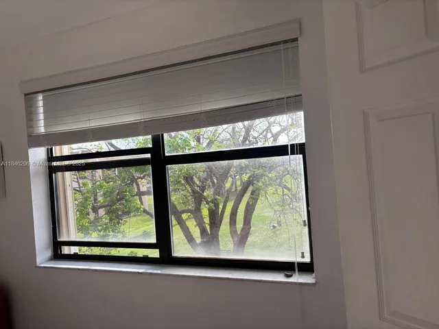 a large bed with a white comforter