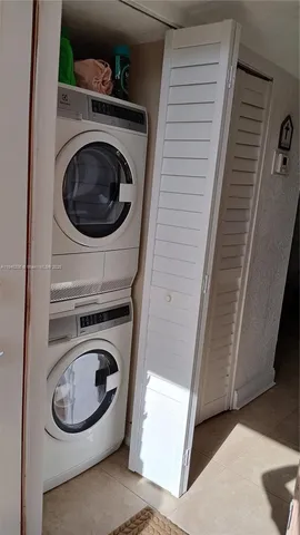 a close view of a utility room with dryer and washer