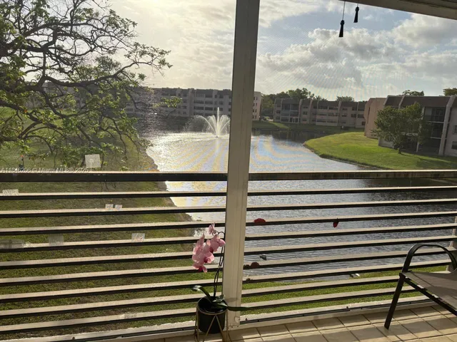 a view of a balcony with a floor to ceiling windows