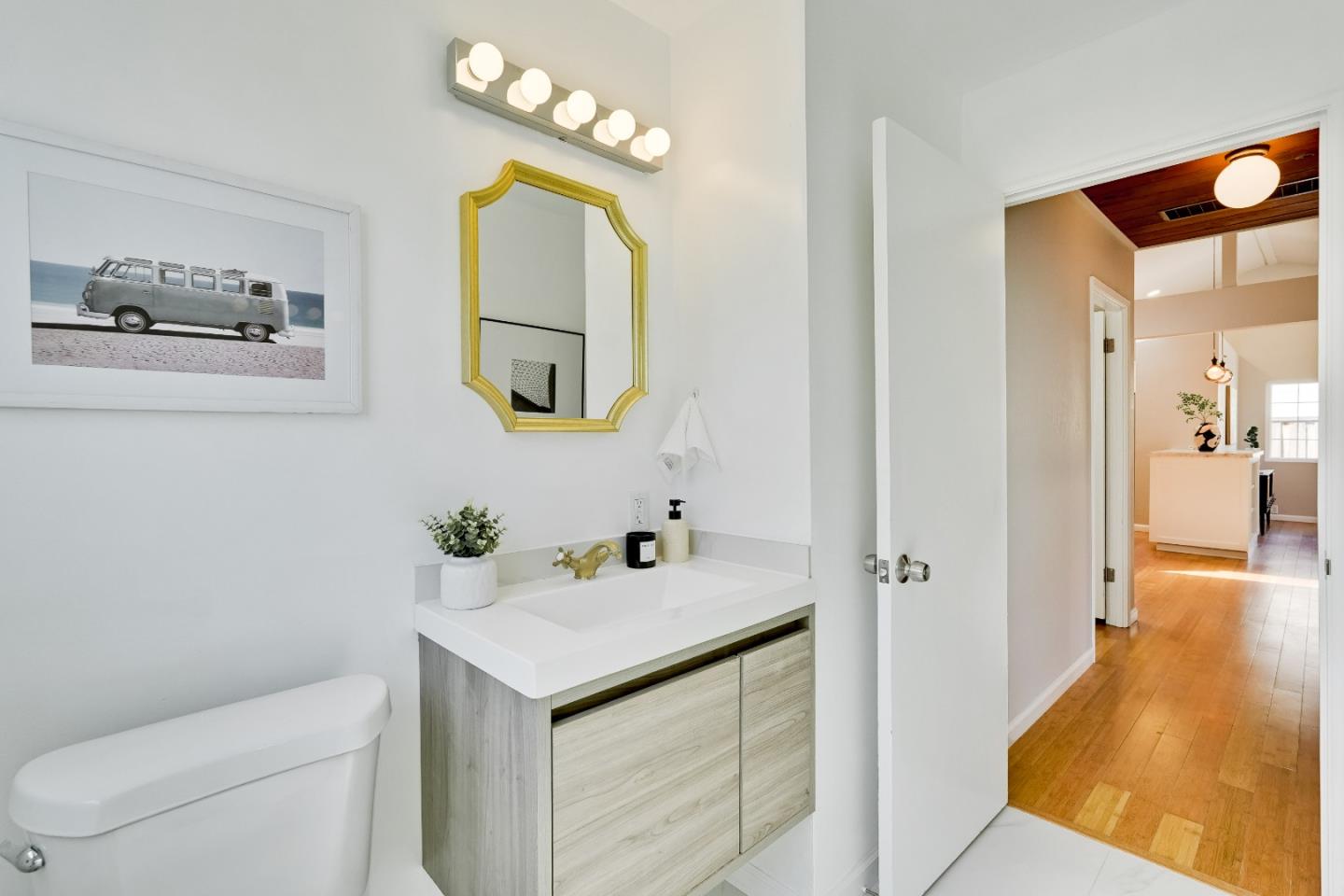 1755 Ravizza Avenue Santa Clara, CA 95051 - Photo 25 of 36 a bathroom with a sink a toilet and mirror
