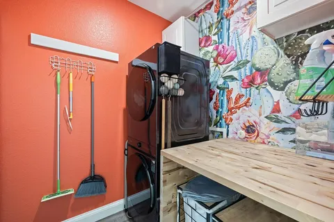 a view of a room with furniture and wooden floor