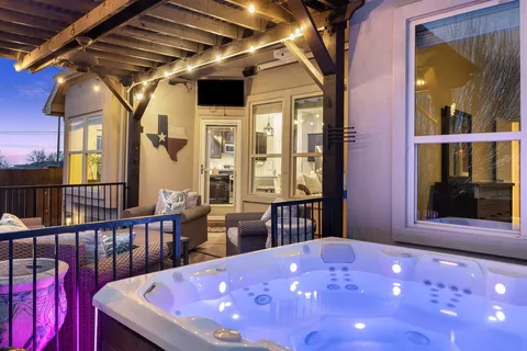 a view of a porch with a table and chairs