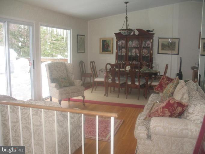11320 Myrtle Lane Reston, VA 20191 - Photo 2 of 7 a dining room with furniture a chandelier and window