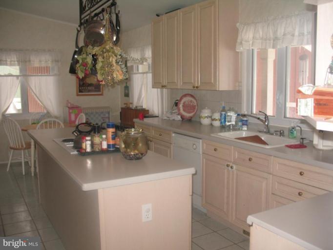 11320 Myrtle Lane Reston, VA 20191 - Photo 6 of 7 a kitchen with a sink and cabinets