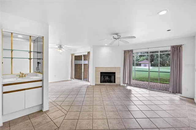 a view of a kitchen with a sink and a fireplace