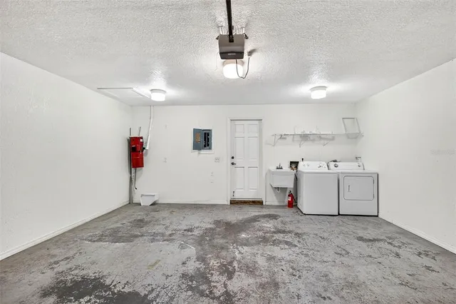 a view of a room with gym equipment and windows