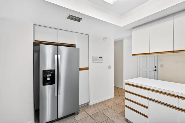 a bathroom with a shower and a glass door