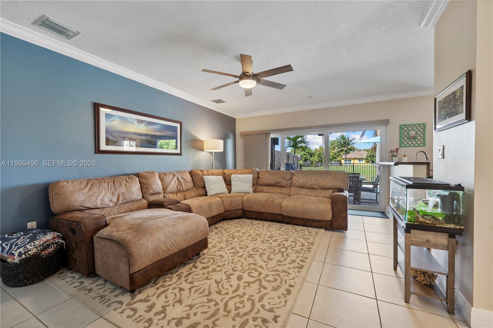 20918 Southwest 89th Path Cutler Bay, FL 33189 - Photo 18 of 47 a living room with furniture and a flat screen tv