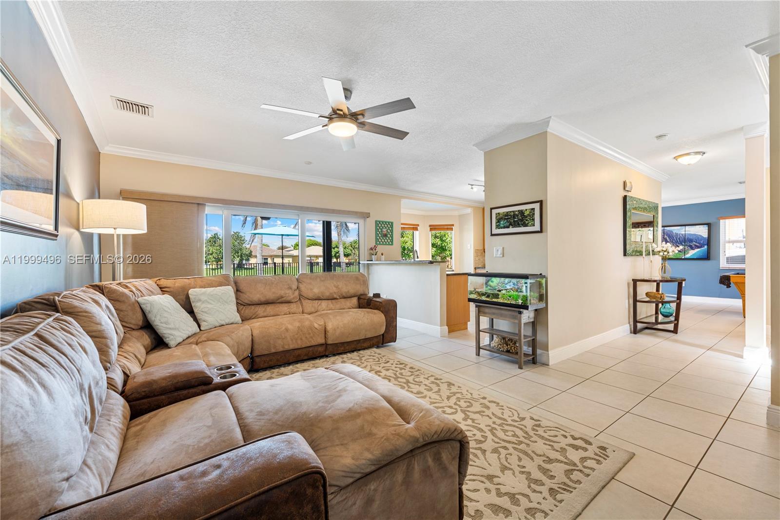 20918 Southwest 89th Path Cutler Bay, FL 33189 - Photo 19 of 47 a living room with furniture and a wooden floor