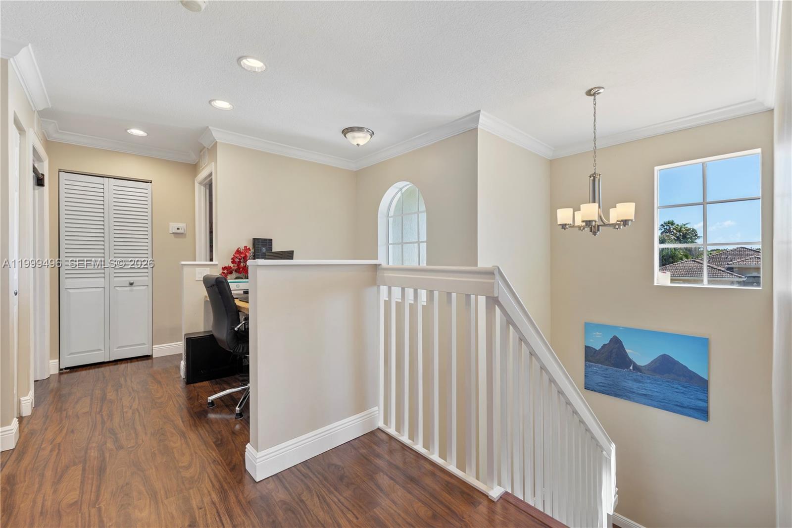 20918 Southwest 89th Path Cutler Bay, FL 33189 - Photo 26 of 47 a view of a hallway with wooden floor and staircase