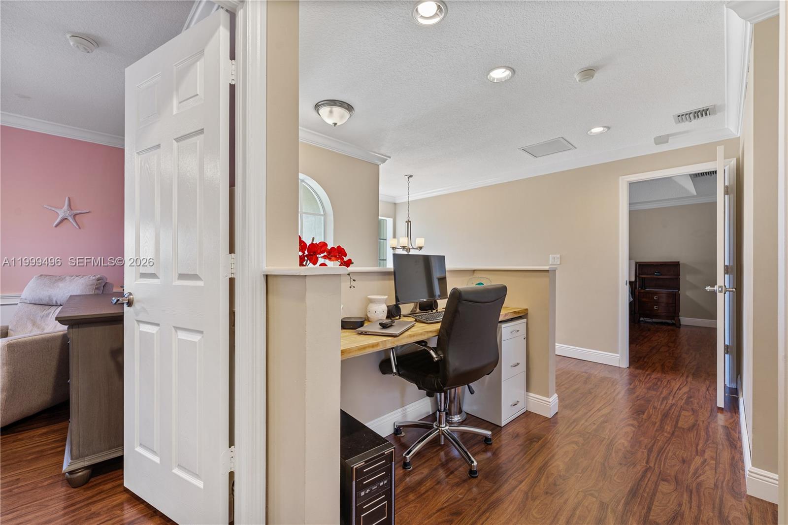 20918 Southwest 89th Path Cutler Bay, FL 33189 - Photo 27 of 47 a view of a workspace with furniture and a bedroom