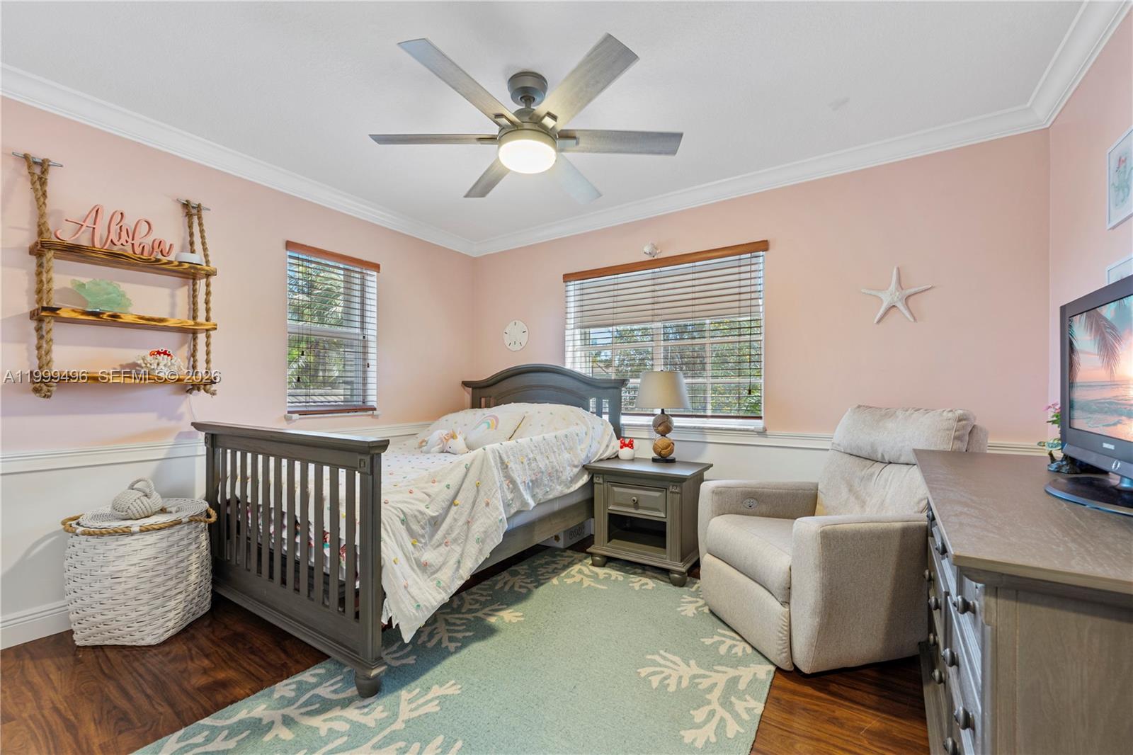 20918 Southwest 89th Path Cutler Bay, FL 33189 - Photo 28 of 47 a bed room with a bed and a couch