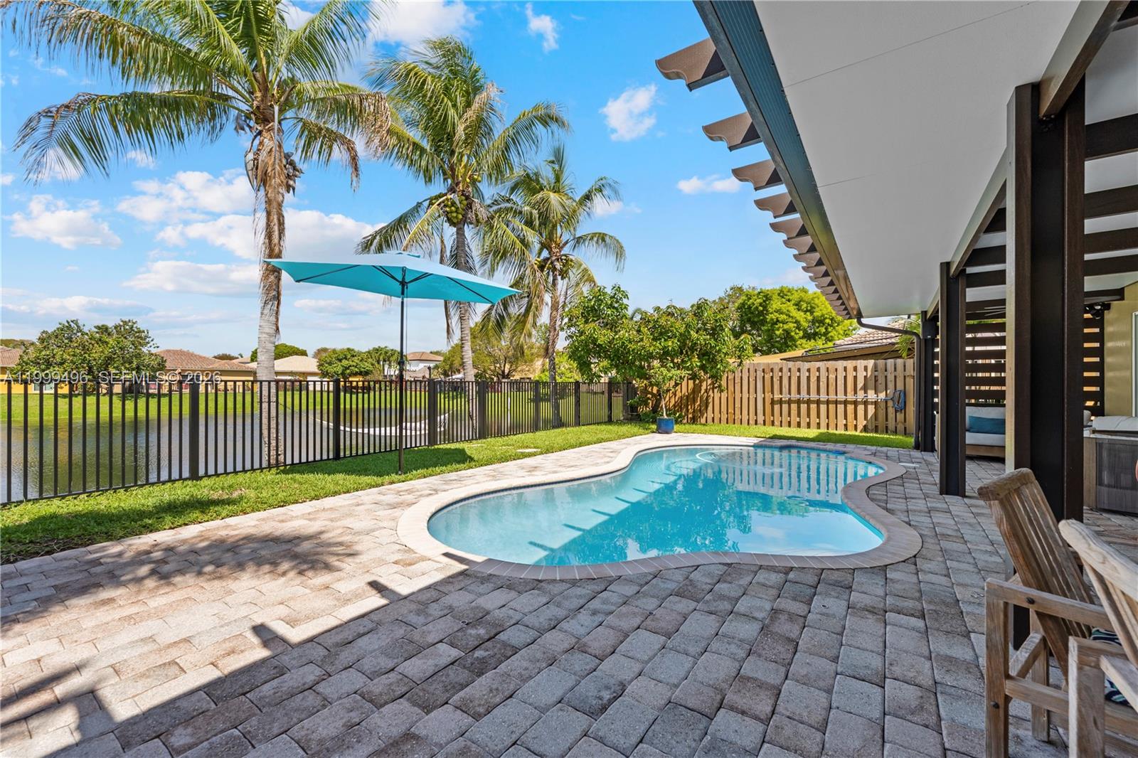 20918 Southwest 89th Path Cutler Bay, FL 33189 - Photo 32 of 47 a view of a backyard with swimming pool