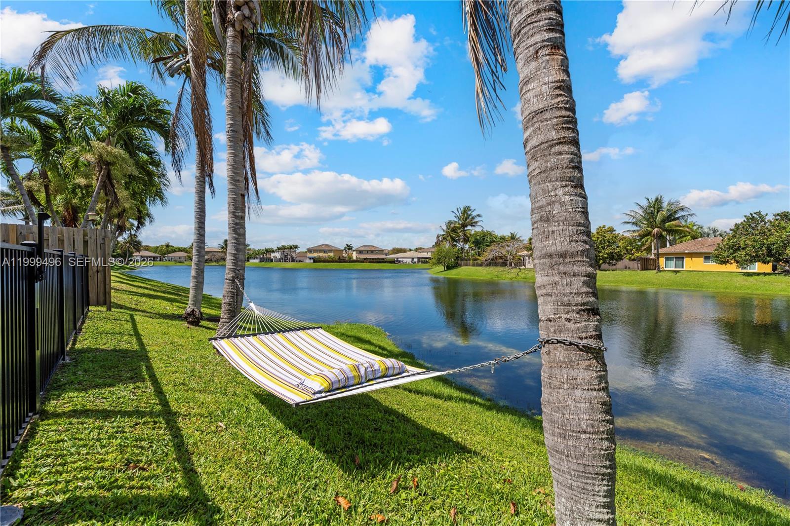 20918 Southwest 89th Path Cutler Bay, FL 33189 - Photo 33 of 47 a view of a lake with a yard