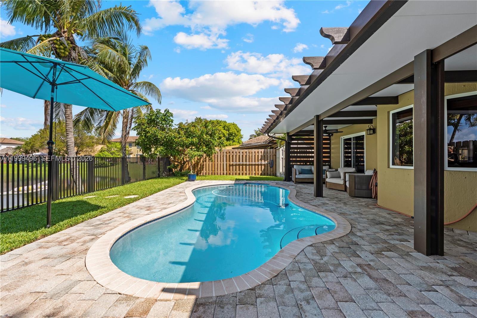 20918 Southwest 89th Path Cutler Bay, FL 33189 - Photo 34 of 47 a view of a house with backyard porch and furniture