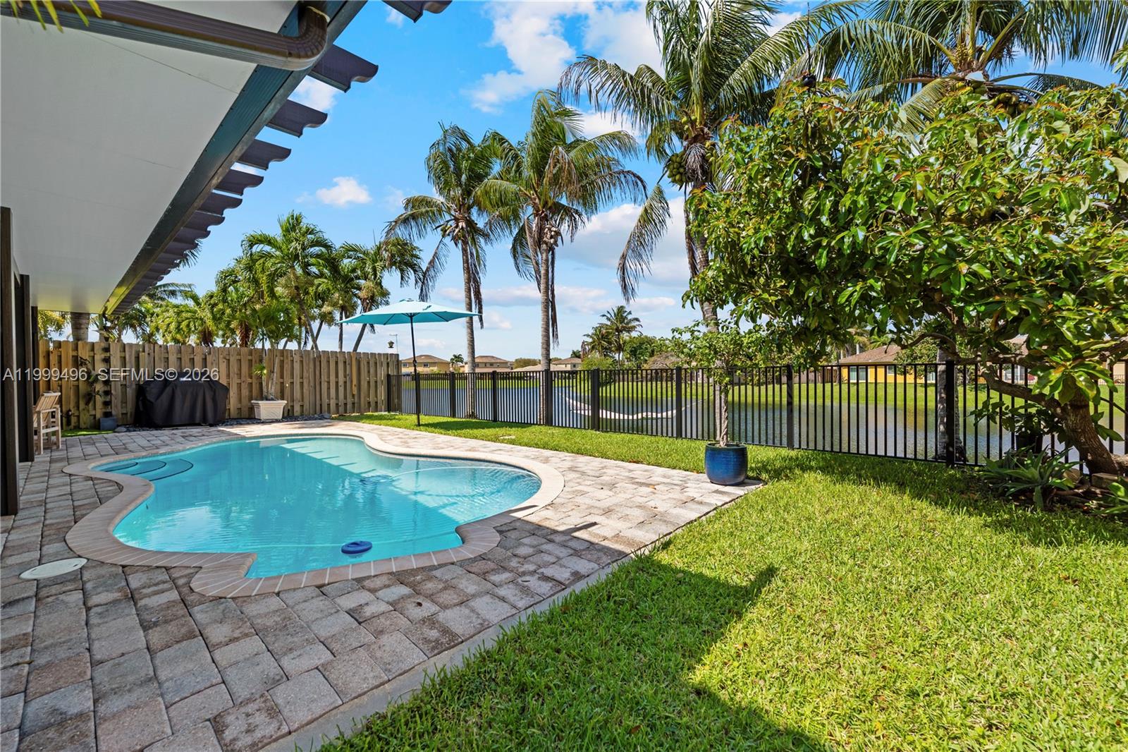 20918 Southwest 89th Path Cutler Bay, FL 33189 - Photo 38 of 47 a view of a backyard with a garden