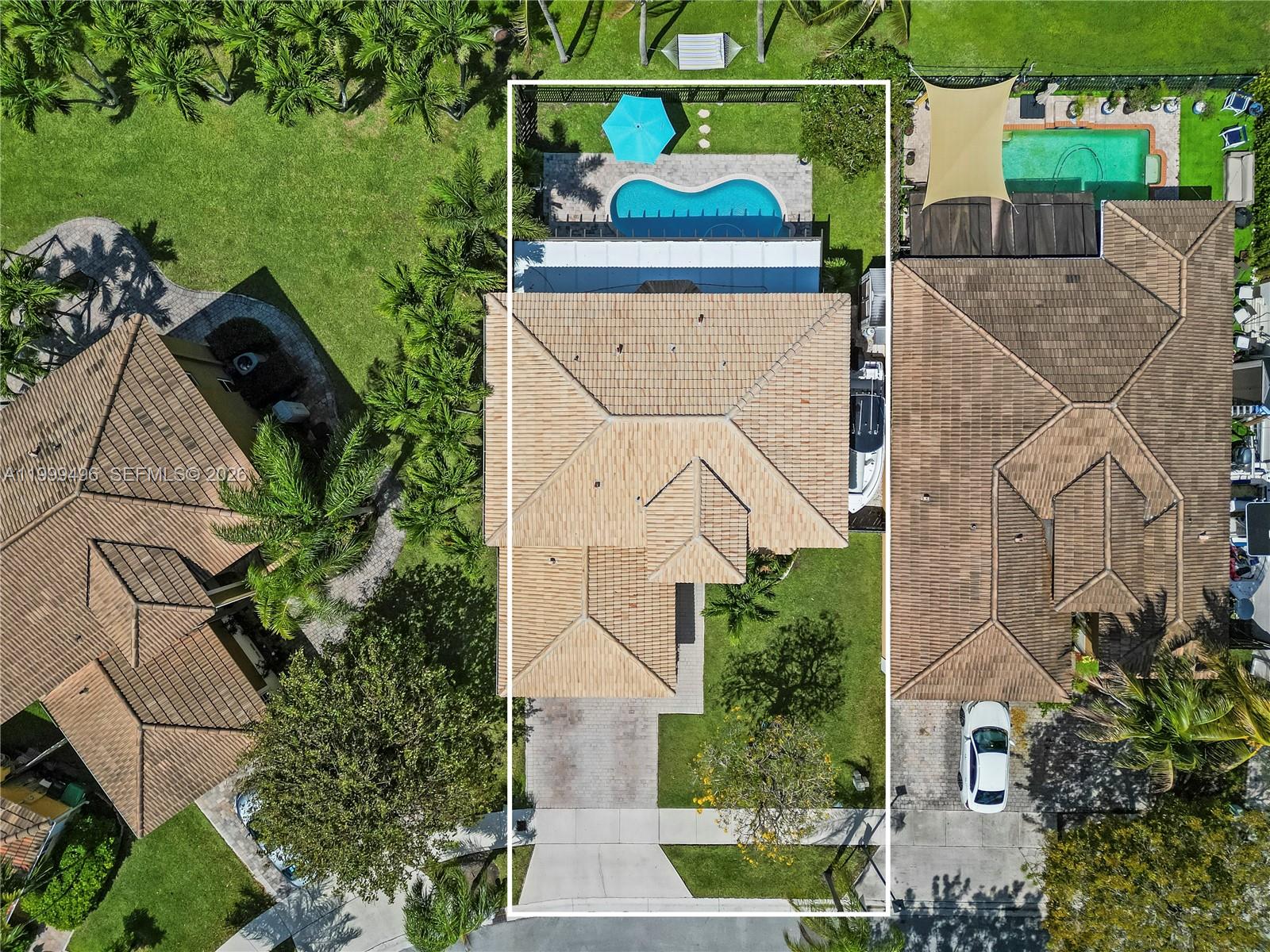 20918 Southwest 89th Path Cutler Bay, FL 33189 - Photo 4 of 47 an aerial view of a house with a yard