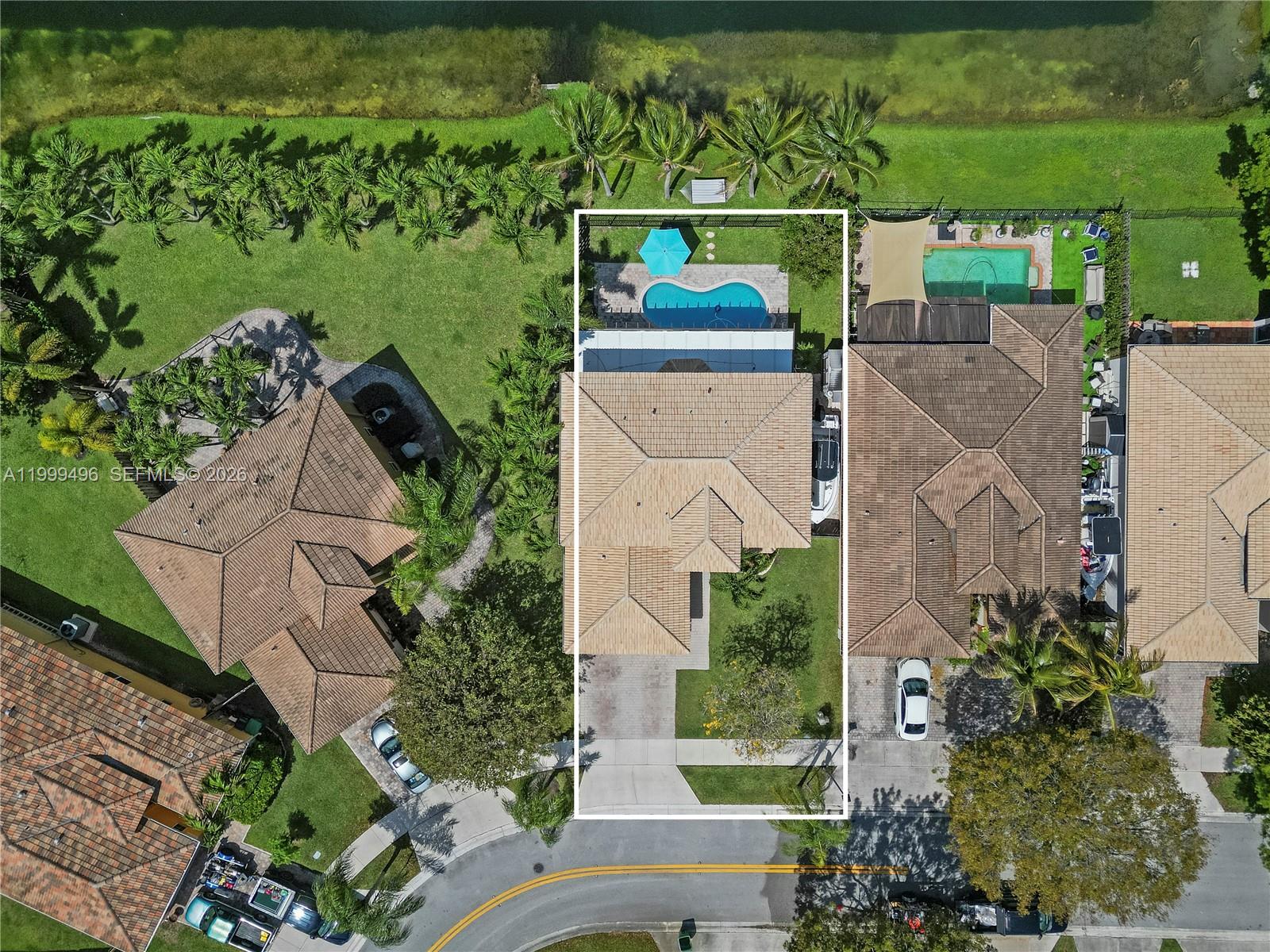20918 Southwest 89th Path Cutler Bay, FL 33189 - Photo 43 of 47 an aerial view of a house with outdoor space and a lake view