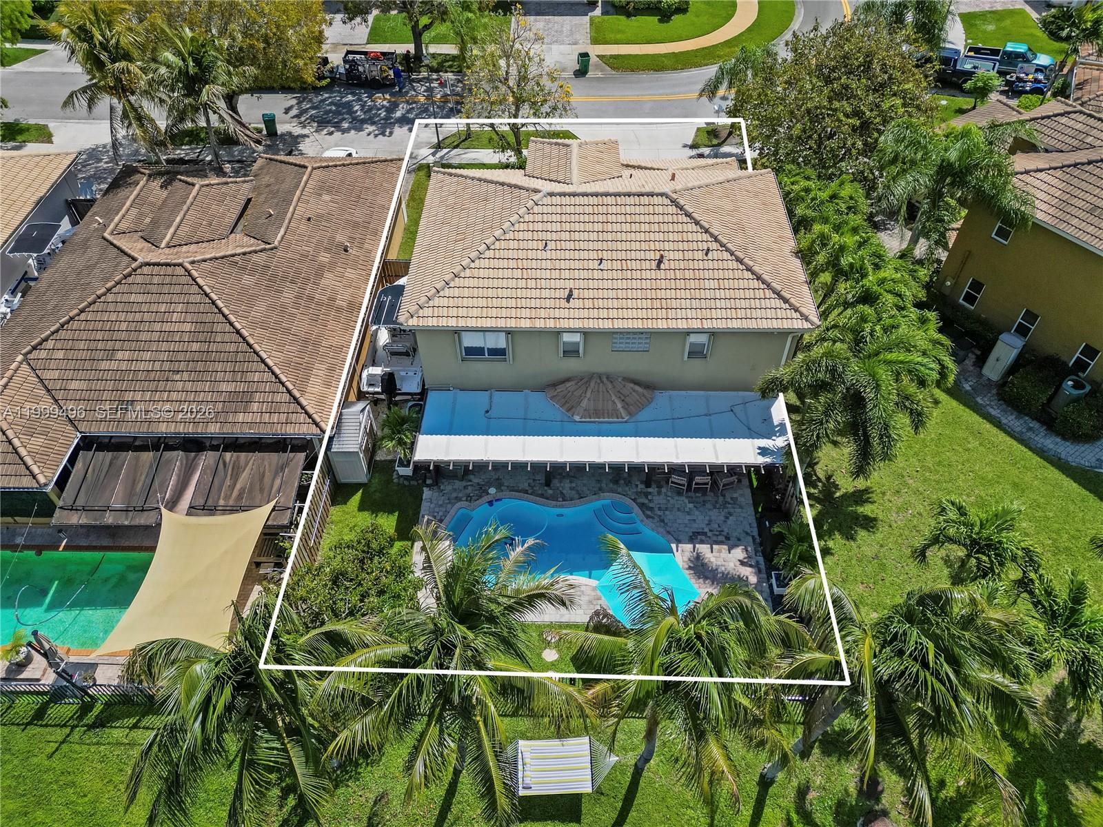 20918 Southwest 89th Path Cutler Bay, FL 33189 - Photo 44 of 47 an aerial view of a house with pool patio and outdoor seating