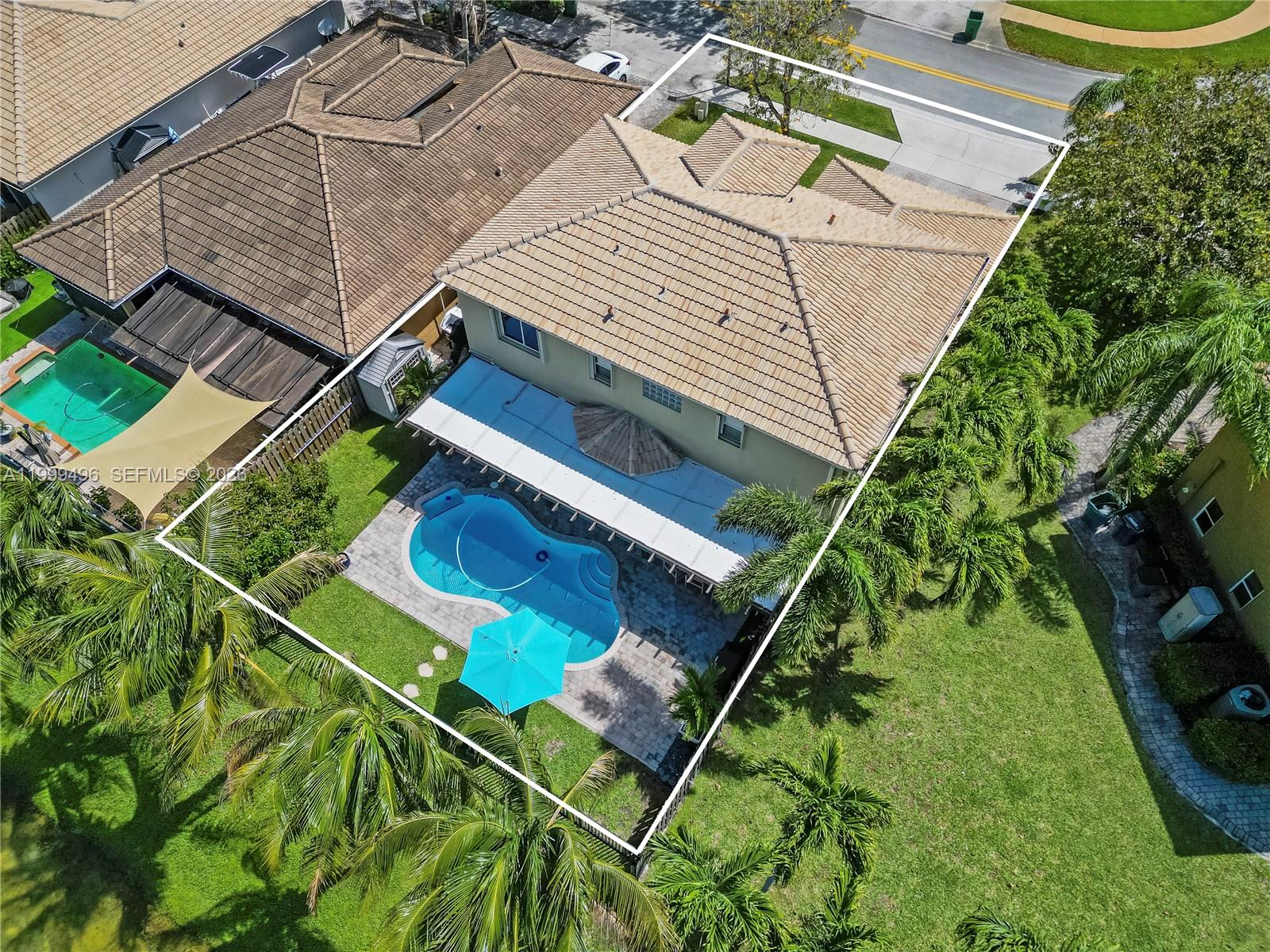 20918 Southwest 89th Path Cutler Bay, FL 33189 - Photo 45 of 47 a aerial view of a house with a garden