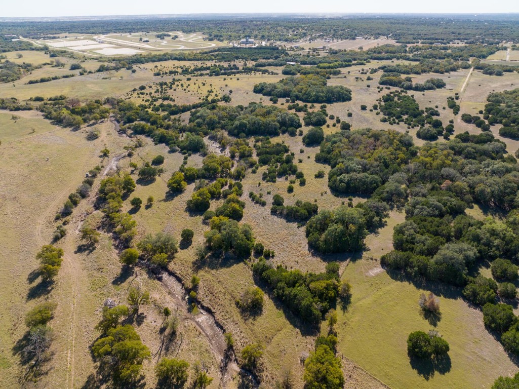 451 County Road 240 Florence, TX 76527 - Photo 1 of 1 an aerial view of ocean beach and residential houses with outdoor space