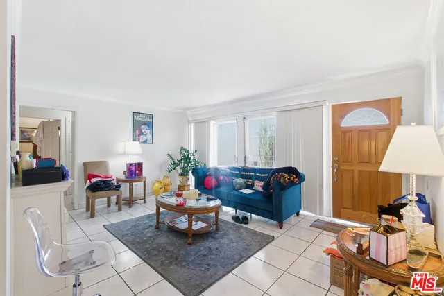 a living room with furniture and a lamp