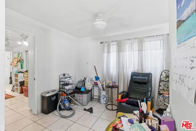 a room with furniture and musical instruments