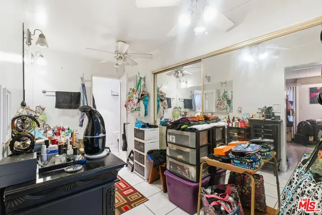 a bathroom with a toilet and a shower curtain