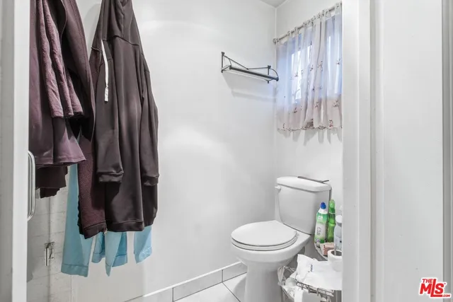 a bathroom with a sink a vanity and a toilet