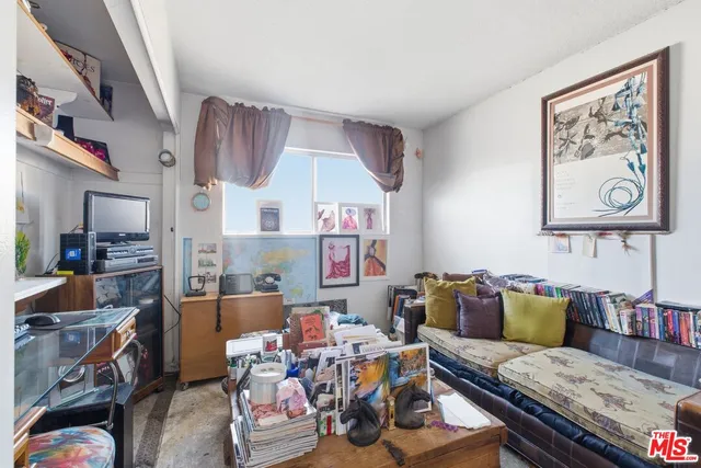 a bed room with a bed and a chair