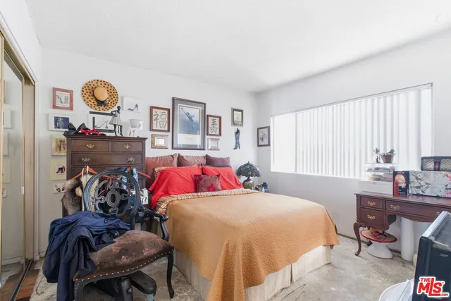 a bathroom with a sink vanity mirror and toilet
