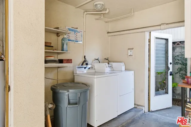 a kitchen with a sink cabinets and appliances