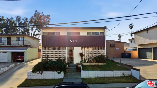 an aerial view of a house with outdoor space