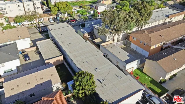 an aerial view of a house with a big yard