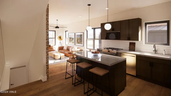 a kitchen with stainless steel appliances granite countertop a sink a stove and a refrigerator