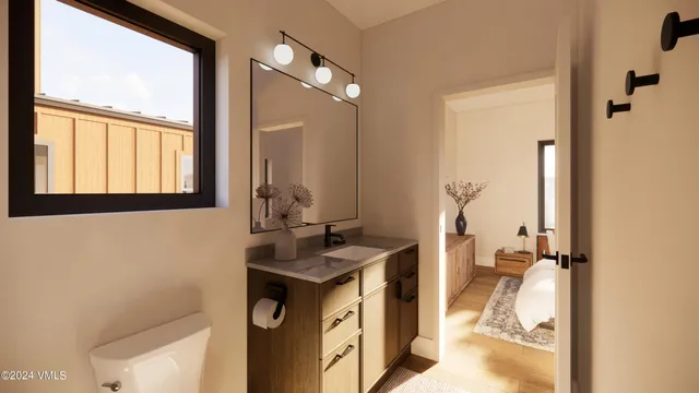 a bathroom with a sink a vanity and a mirror