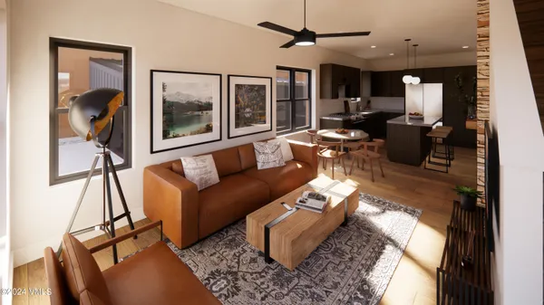 a living room with furniture flowerpot and a chandelier
